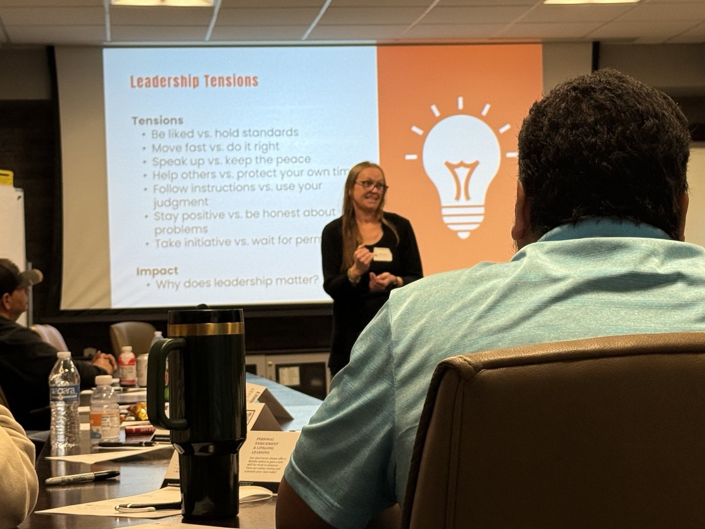 Melody Edwards leading a Leadership Tensions training session for working professionals